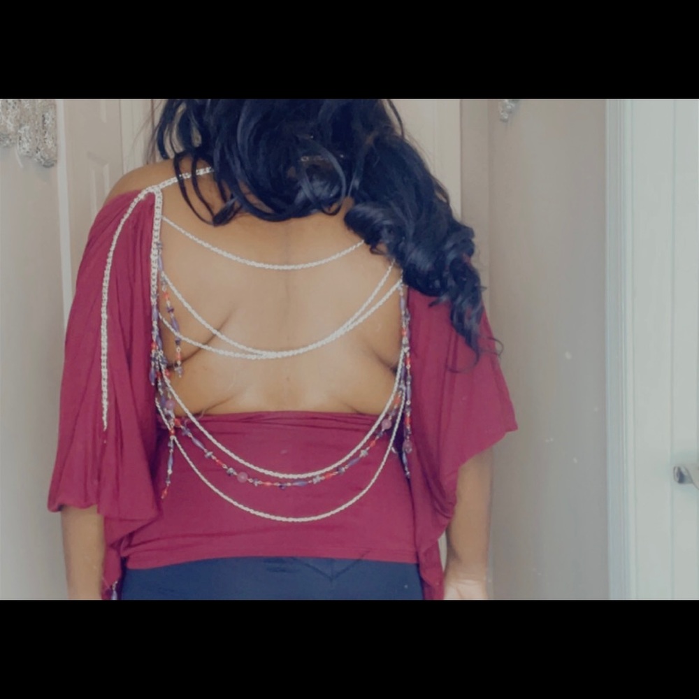 Open low cut back top.